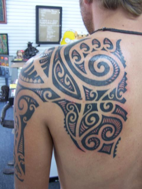 polinesian tattoo. tiki/polynesian tattoo?